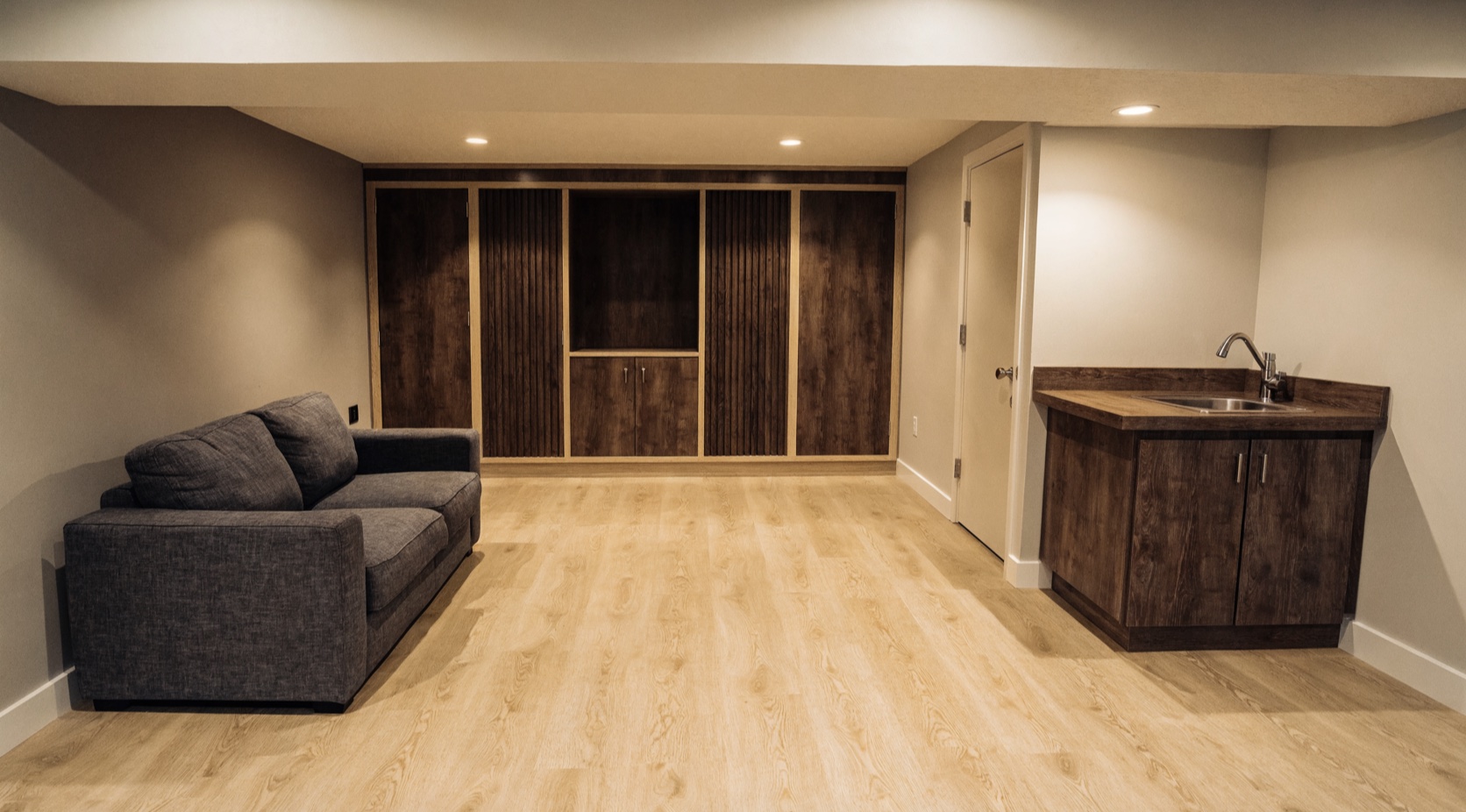 Photorealistic finished basement renovation concept for Windsor Ontario